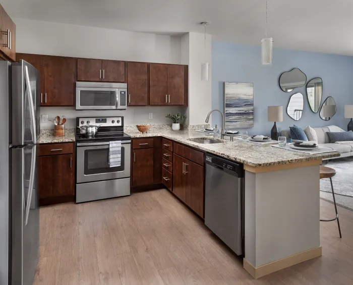 Apartment kitchen featuring updated cabinetry, modern appliances, and functional layouts.