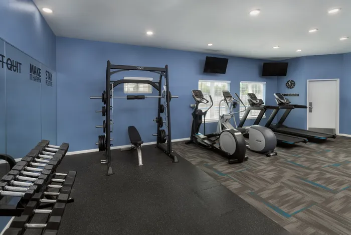 Fitness center at Manchester Oaks Apartments in Franklin, Wisconsin featuring updated exercise equipment for residents.