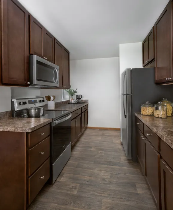 Kitchen at Manchester Oaks Apartments in Franklin, Wisconsin with modern appliances and finishes.