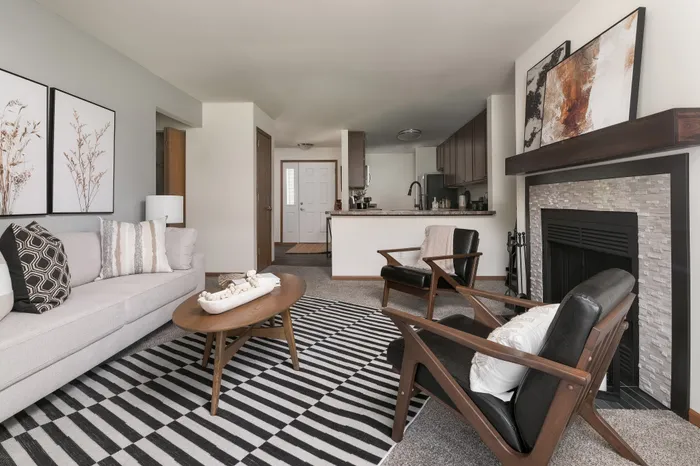 Living room at Manchester Oaks Apartments in Franklin, Wisconsin with spacious layouts and natural light.