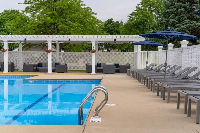 Heated outdoor pool at Manchester Oaks Apartments in Franklin, Wisconsin for resident recreation and relaxation.