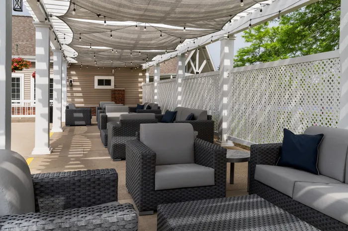 Sundeck and lounge seating at Manchester Oaks Apartments in Franklin, Wisconsin offering outdoor relaxation spaces.