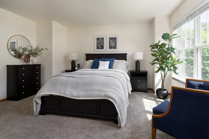 Primary bedroom at Manchester Oaks Apartments in Franklin, Wisconsin offering spacious and comfortable living.