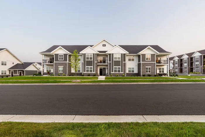 Exterior view of stacked flat apartment buildings at Apex at Verona in Verona, WI.