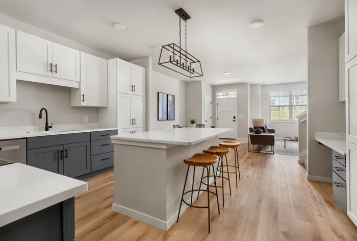 Modern townhome kitchen with contemporary finishes at Apex at Verona in Verona, WI.