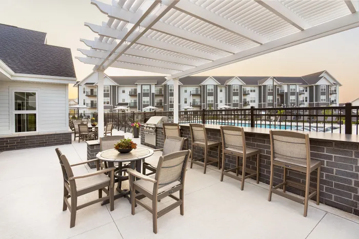 Community grill station and outdoor dining area at Apex at Verona in Verona, WI
