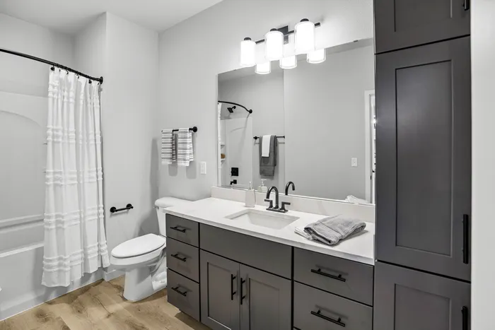Modern apartment bathroom with contemporary finishes at Apex at Verona in Verona, WI.