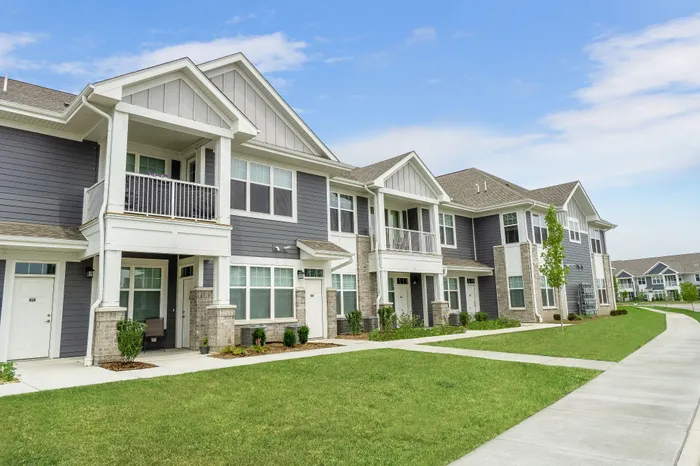 Apartment building exterior at Seasons at Plainfield Apartments in Plainfield, Illinois.