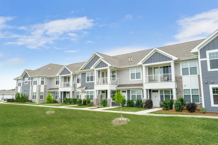 Apartment building exterior at Seasons at Plainfield Apartments in Plainfield, Illinois.