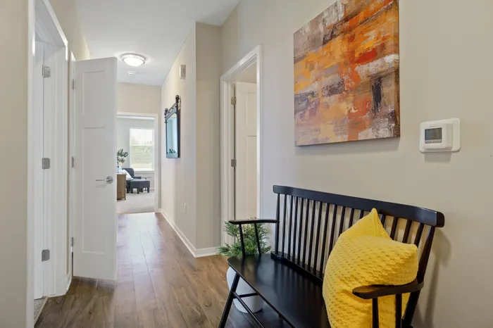 Apartment hallway interior at Seasons at Plainfield Apartments in Plainfield, Illinois.