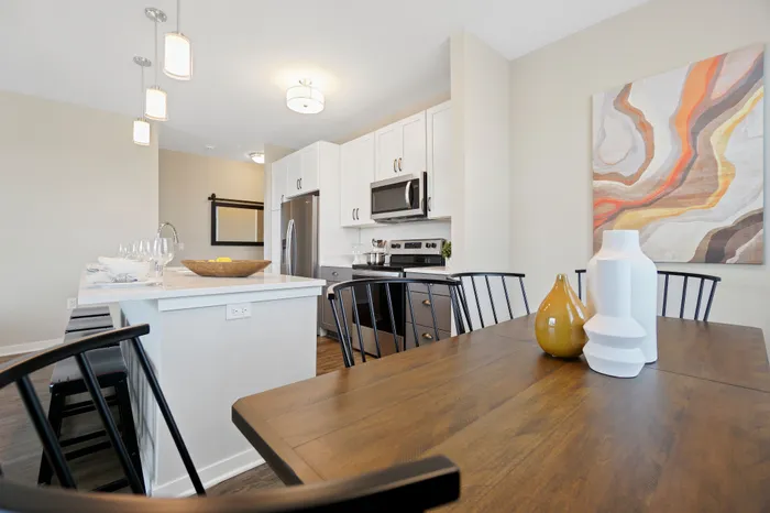 Apartment kitchen interior at Seasons at Plainfield Apartments in Plainfield, Illinois.