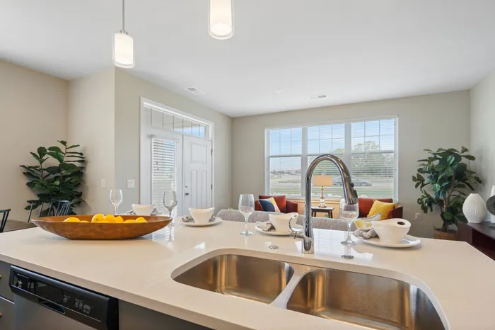 Apartment kitchen interior at Seasons at Plainfield Apartments in Plainfield, Illinois.