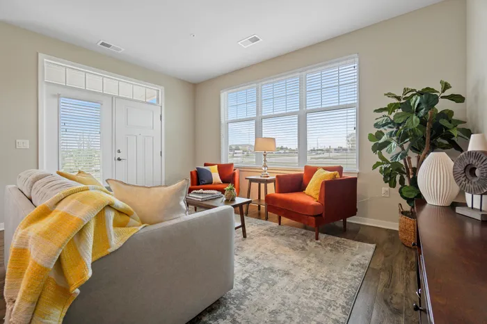 Apartment living room interior at Seasons at Plainfield Apartments in Plainfield, Illinois.