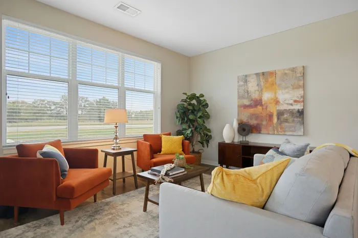 Apartment living room interior at Seasons at Plainfield Apartments in Plainfield, Illinois.