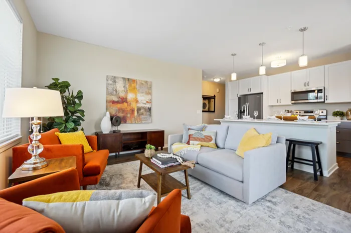 Apartment living room interior at Seasons at Plainfield Apartments in Plainfield, Illinois.