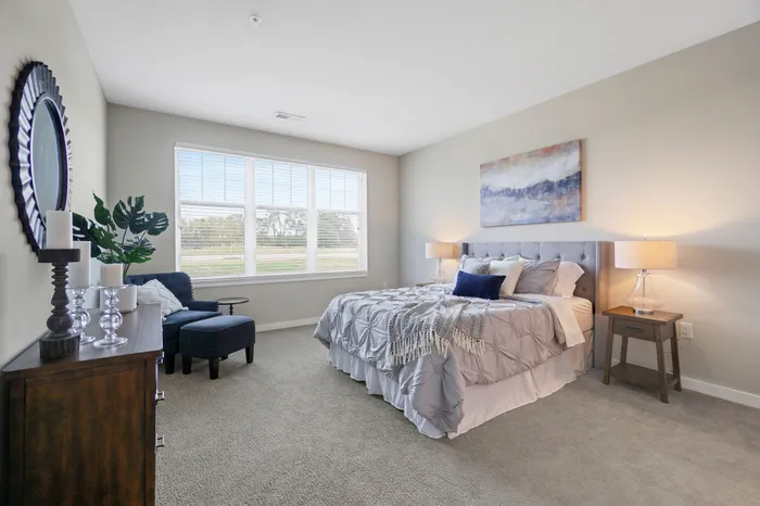 Apartment bedroom interior at Seasons at Plainfield Apartments in Plainfield, Illinois.
