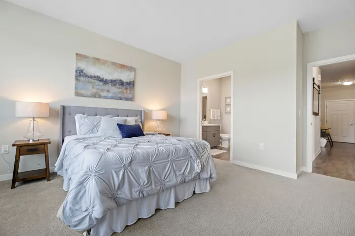 Apartment bedroom interior at Seasons at Plainfield Apartments in Plainfield, Illinois.