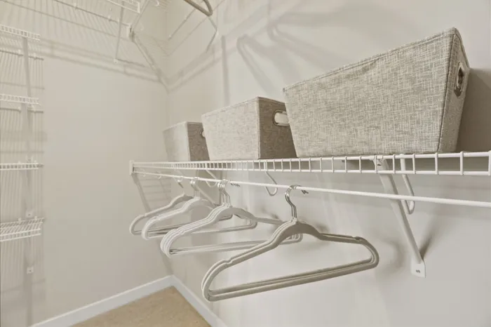 Walk-in closet inside apartment at Seasons at Plainfield Apartments in Plainfield, Illinois.