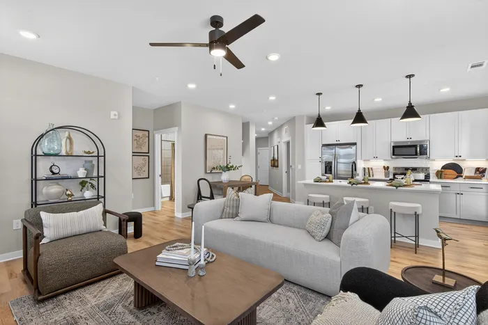 Open-concept living room at Echelon at Charlotte with large windows and comfortable layout