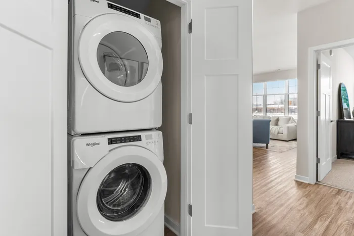 Washer and dryer inside apartment home at Seasons at Spring Street