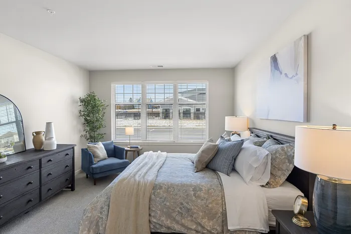 Bedroom with natural light and comfortable space at Seasons at Spring Street