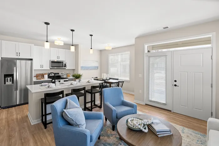 Living room with open layout and natural light at Seasons at Spring Street