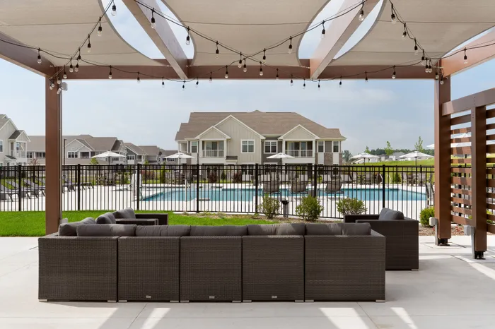 Outdoor pergola seating area with lounge space at Seasons at Spring Street