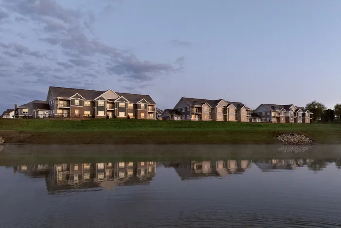 Exterior view of modern stacked flats at Terrapin Run apartments featuring contemporary architecture and spacious apartment homes.