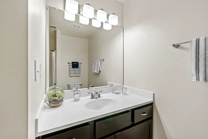 Bathroom at Saddlebrook Apartments in Pewaukee, Wisconsin with clean finishes and fixtures.