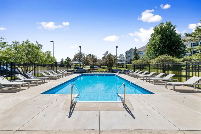 Sparkling outdoor pool at Riverwood Apartments in Kenosha, Wisconsin.
