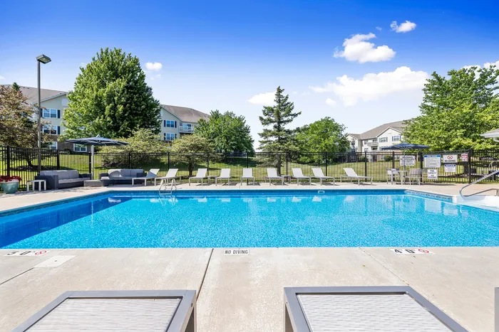 Sparkling outdoor pool at Riverwood Apartments in Kenosha, Wisconsin.