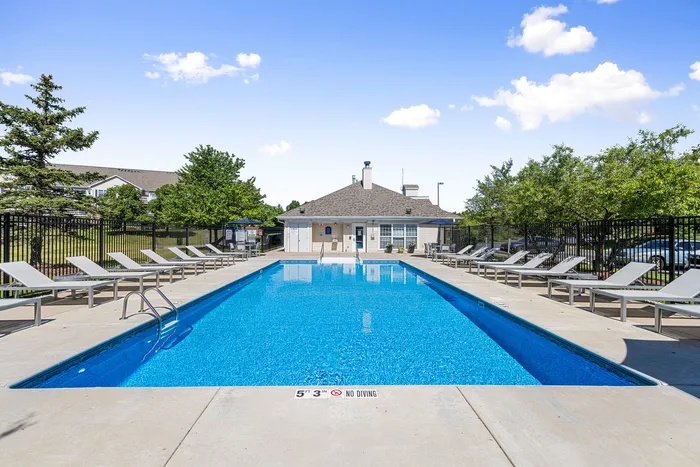 Sparkling outdoor pool at Riverwood Apartments in Kenosha, Wisconsin.