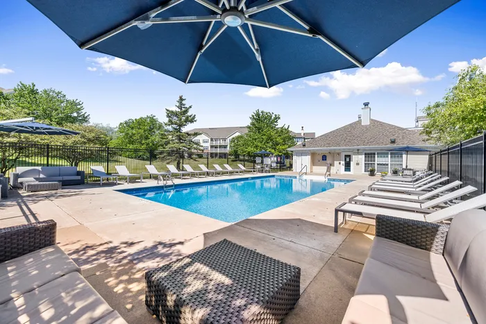 Sparkling outdoor pool deck at Riverwood Apartments in Kenosha, Wisconsin.