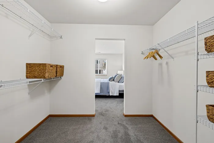 Primary bedroom Closet at Saddlebrook Apartments in Pewaukee, Wisconsin.
