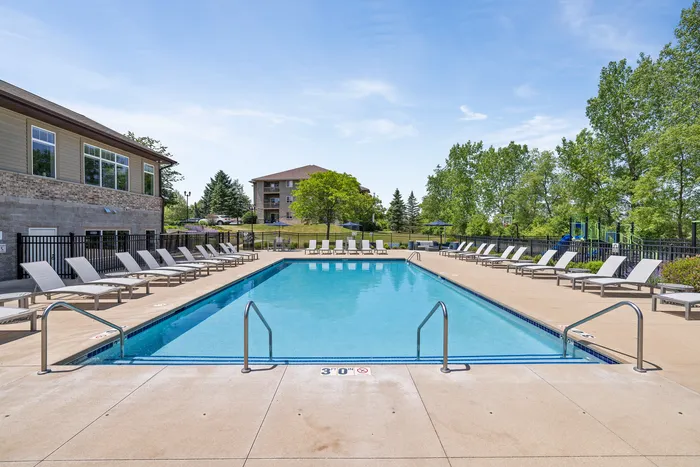 Heated outdoor pool at Saddlebrook Apartments in Pewaukee, Wisconsin.