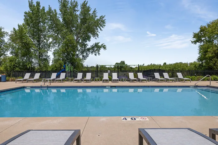 Heated outdoor pool at Saddlebrook Apartments in Pewaukee, Wisconsin.