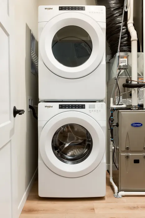 In-unit washer and dryer in a Terrapin Run stacked flat home.