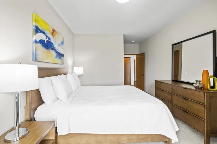 Carpeted modern bedroom at 50Twenty Apartments in Madison, Wisconsin.