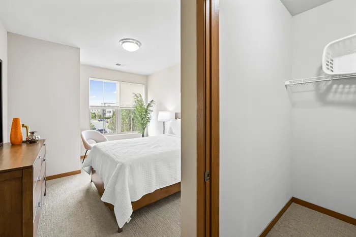 Carpeted modern bedroom at 50Twenty Apartments in Madison, Wisconsin.
