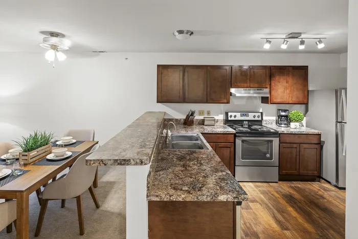Kitchen with stainless steel appliances at Barrington Place Apartments in Madison, Wisconsin.