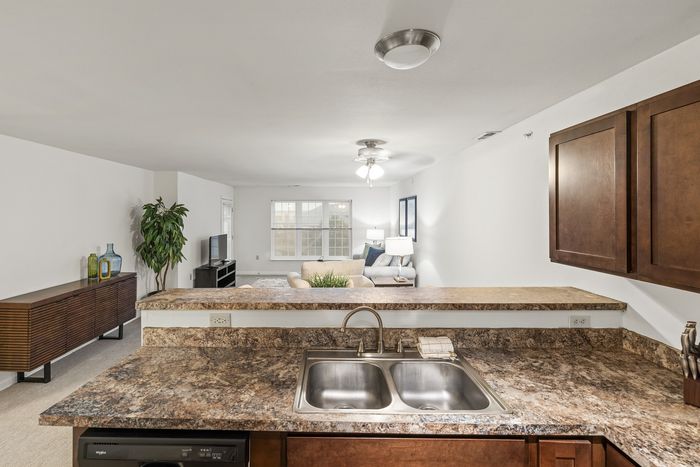 Kitchen with stainless steel appliances at Barrington Place Apartments in Madison, Wisconsin.