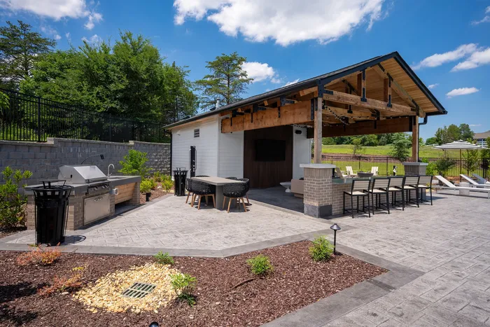 Outdoor TV lounge with comfortable seating at Echelon at Charlotte