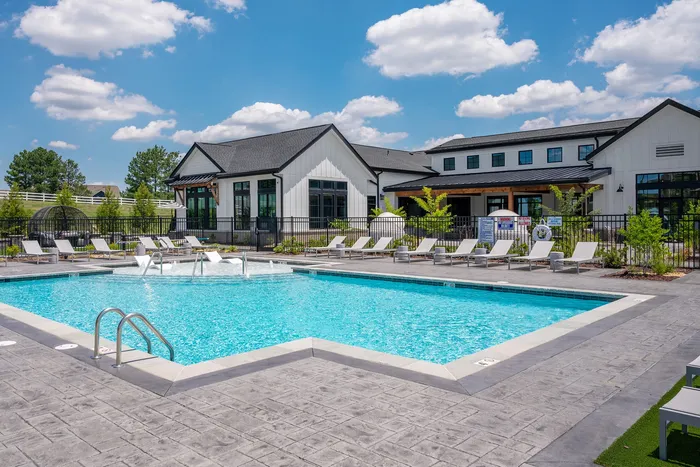 Resort-style swimming pool with lounge seating at Echelon at Charlotte