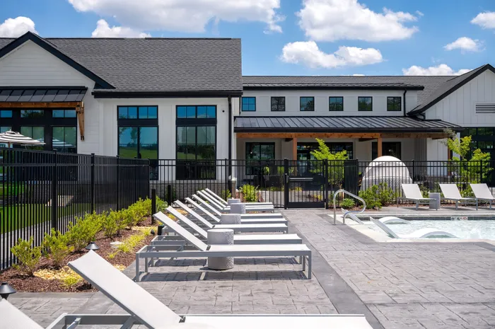 Resort-style swimming pool with lounge seating at Echelon at Charlotte