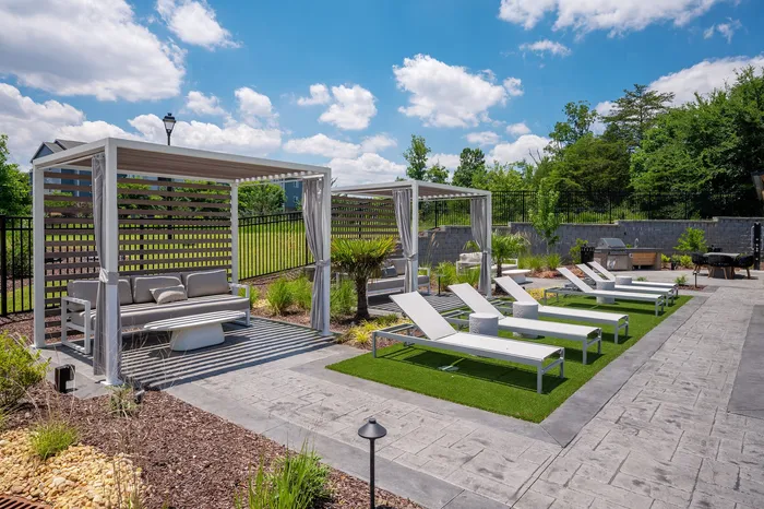 Resort-style swimming pool with lounge seating at Echelon at Charlotte