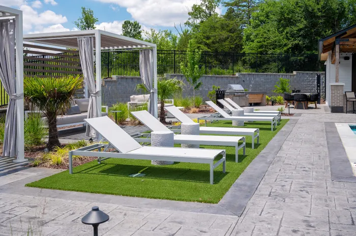 Resort-style swimming pool with lounge seating at Echelon at Charlotte