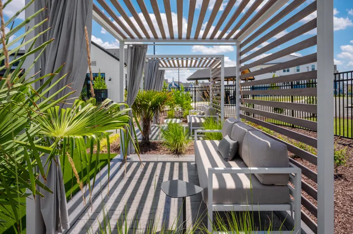 Resort-style swimming pool with lounge seating at Echelon at Charlotte