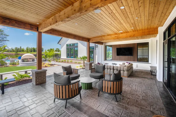 Luxury apartment outdoor patio with lounge seating at Echelon at Charlotte in Charlotte, North Carolina.