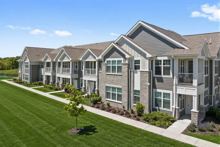 Modern apartment building exterior at Seasons at River View Apartments in Pleasant Prairie, Wisconsin.