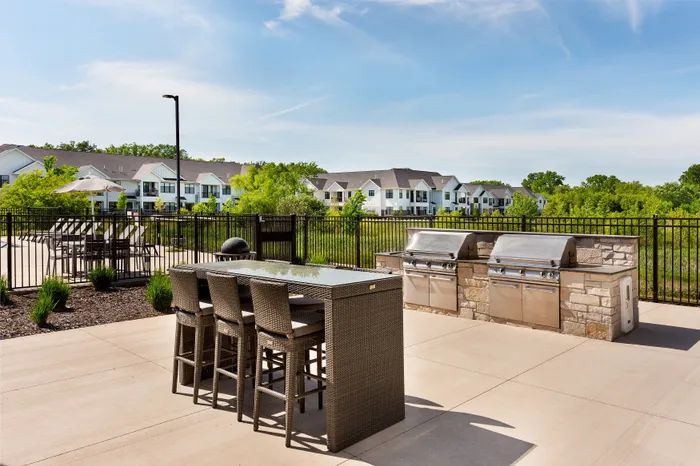 Outdoor grilling station and dining patio at Seasons at Franklin luxury apartments in Franklin, Wisconsin.
